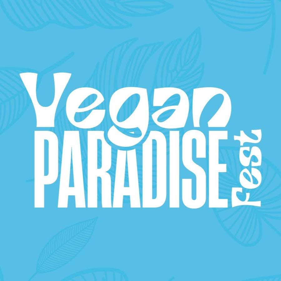 Sky blue background with white words over it that read “Vegan Paradise Fest”