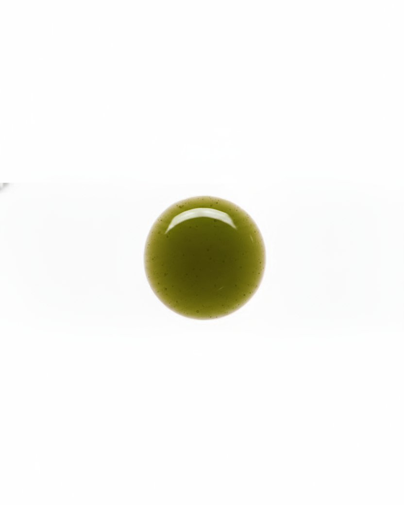Green olive drop oil on a white background