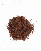Close-up of ground cacao on a white background