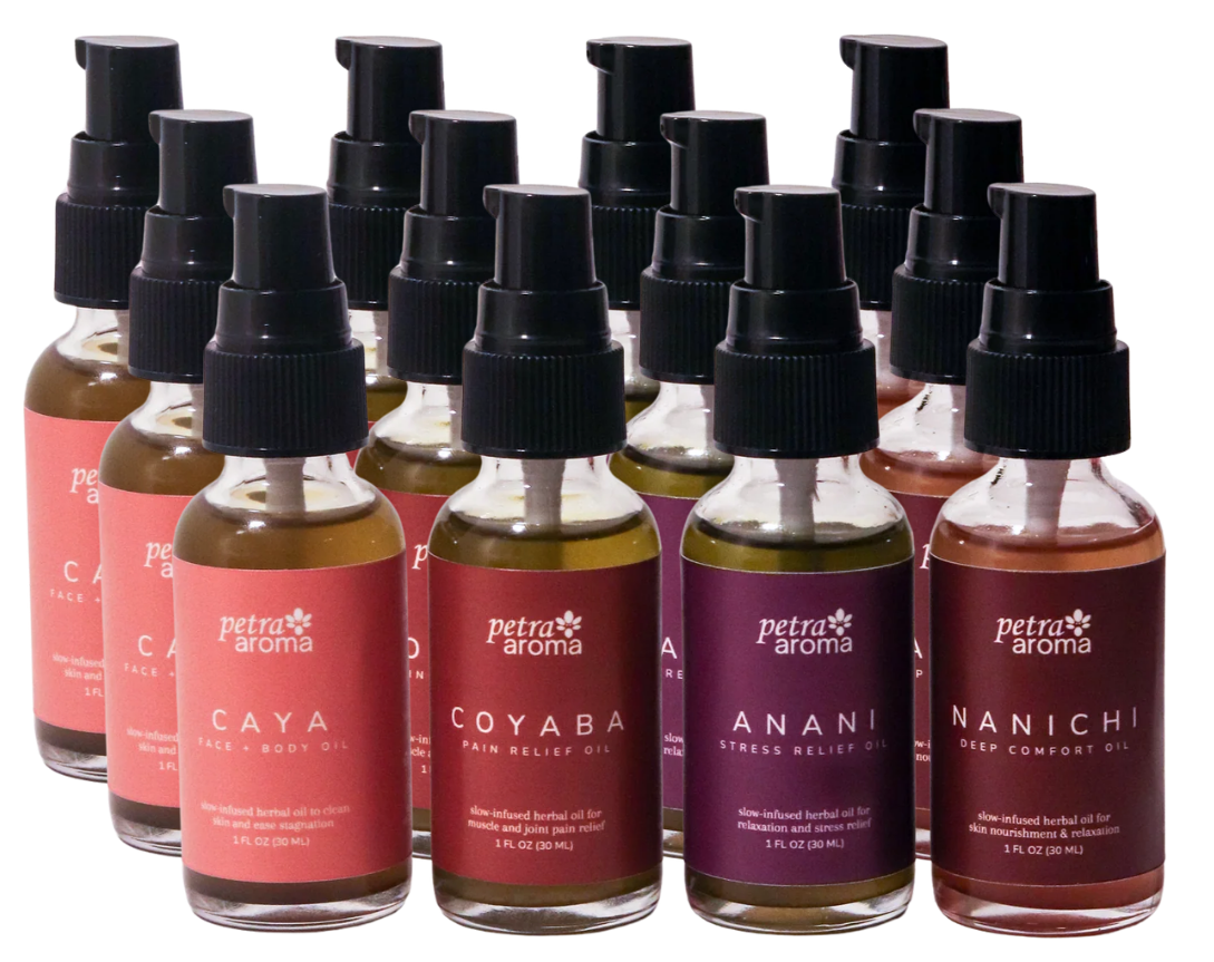 Set of 12 small bottles with black caps on a white background