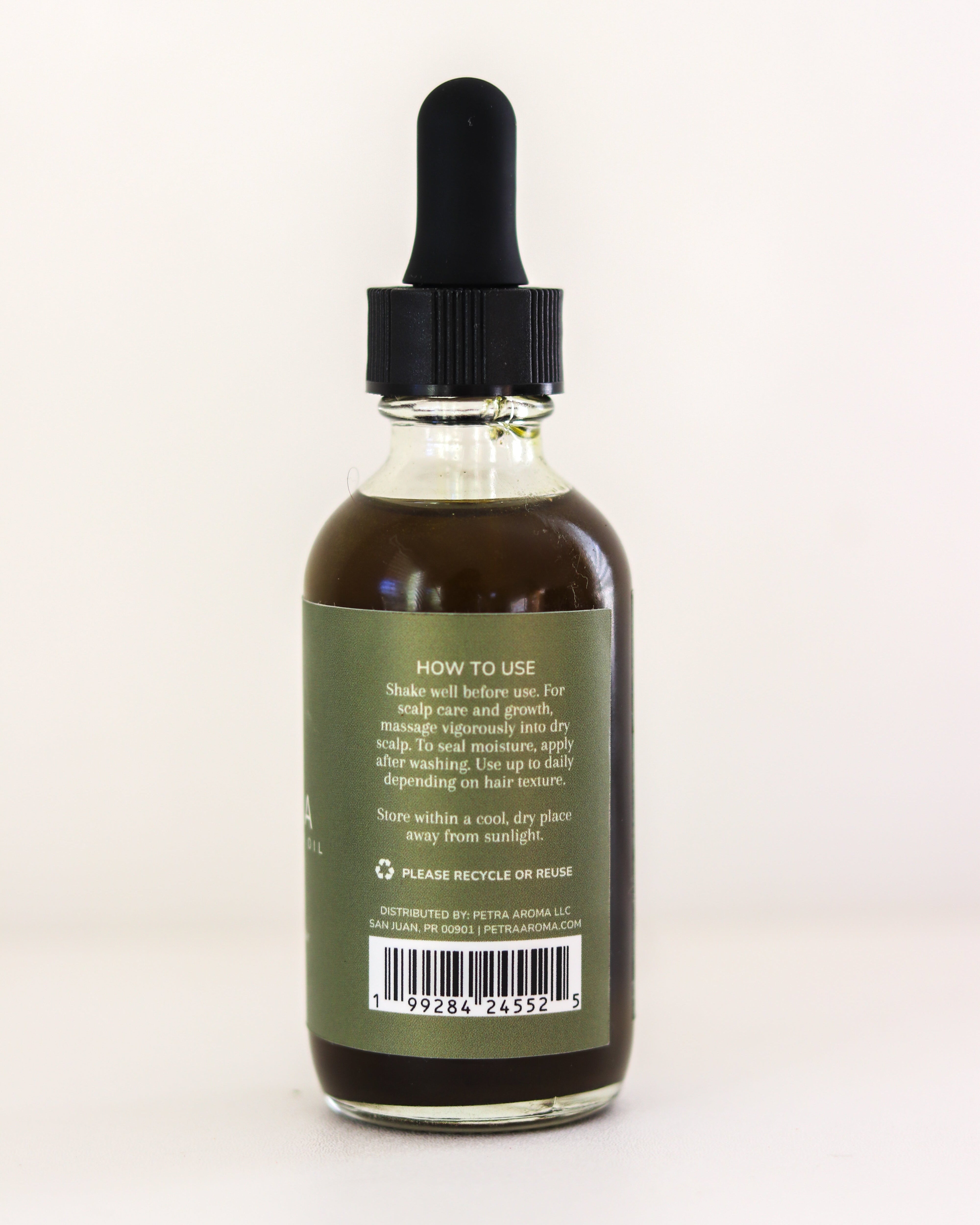 Bottle with dropper labeled 'How to Use' on a white background