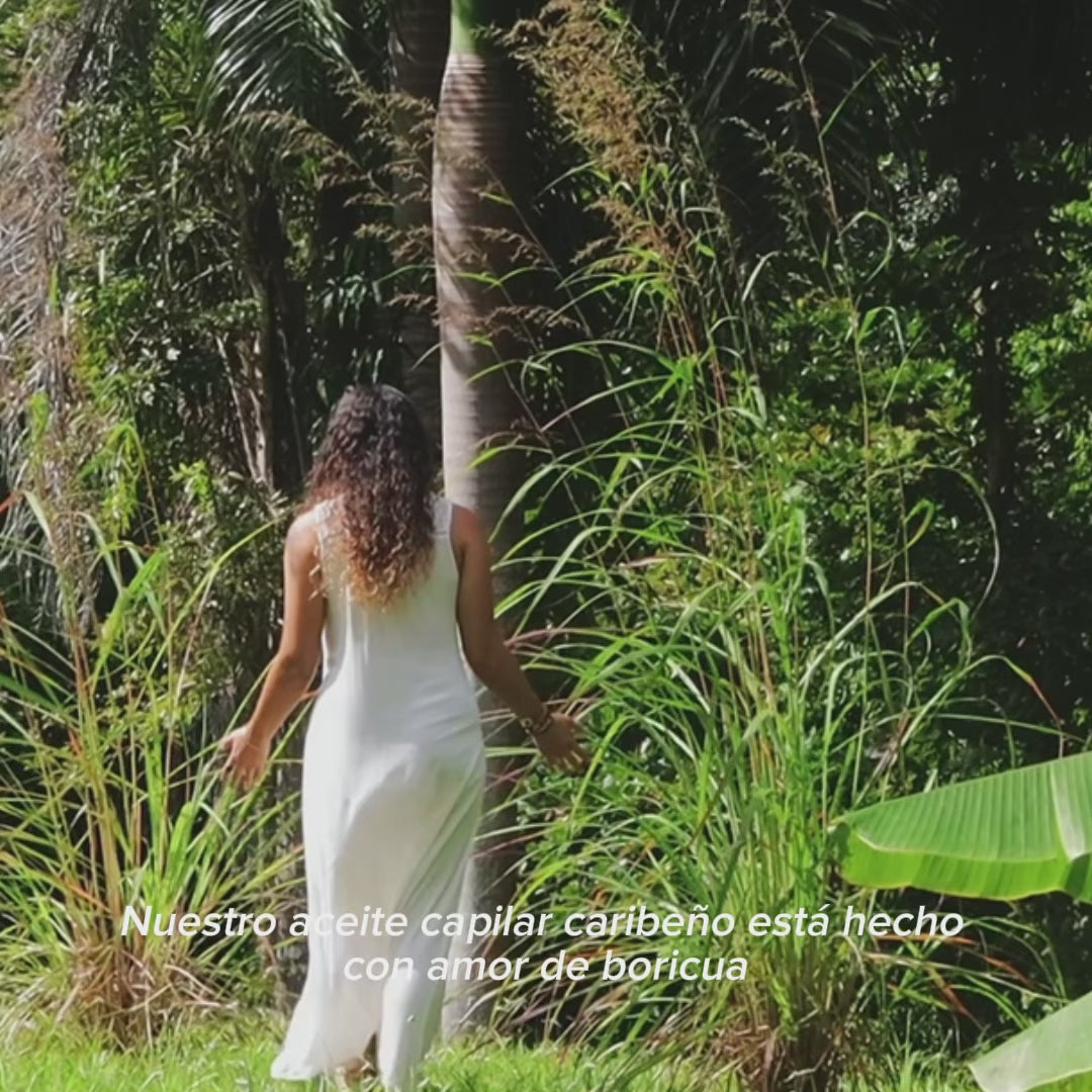 Dr. Daniella Olan in a forest talking about GUADA nourishing hair oil.